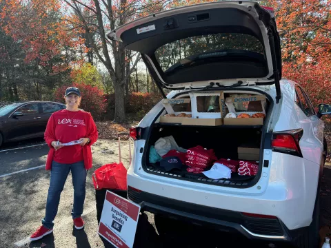 Photo of Kris Countryman next to packed car